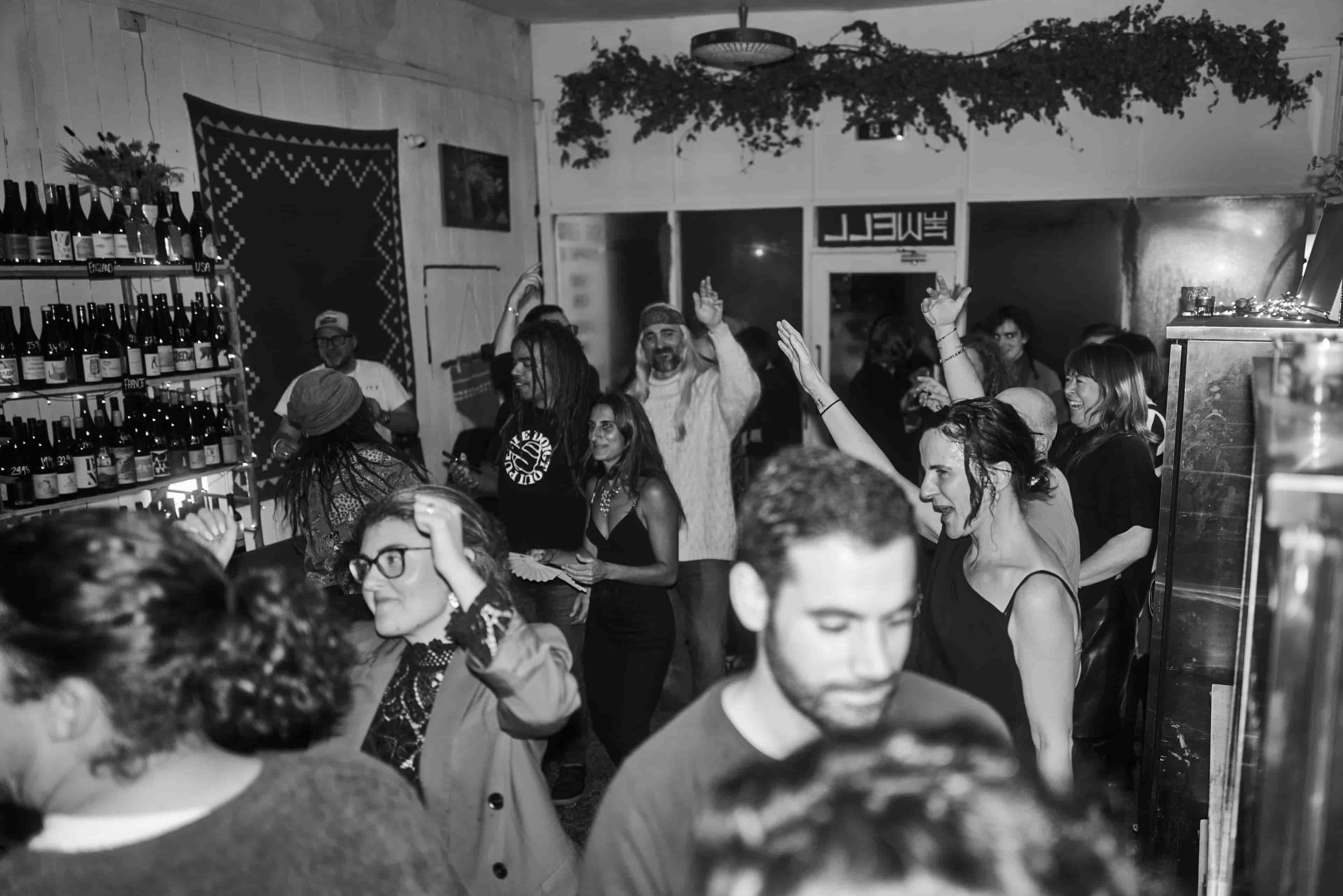 Party in the pub, people dancing.