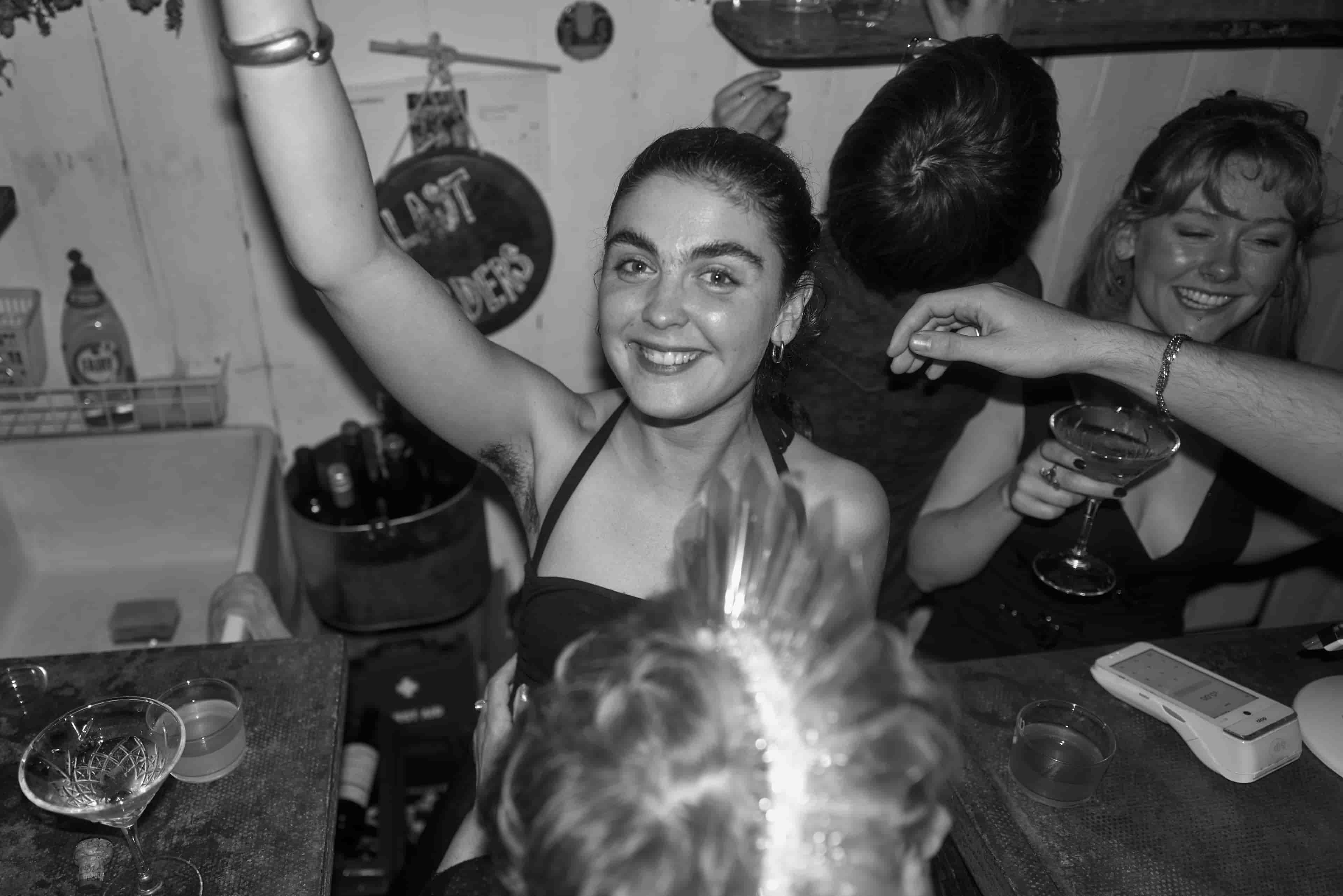 Person raising a glass.