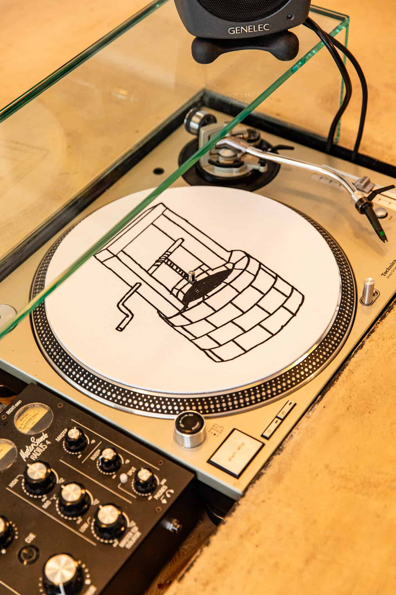 Turntable behind bar by Ellen Richardson