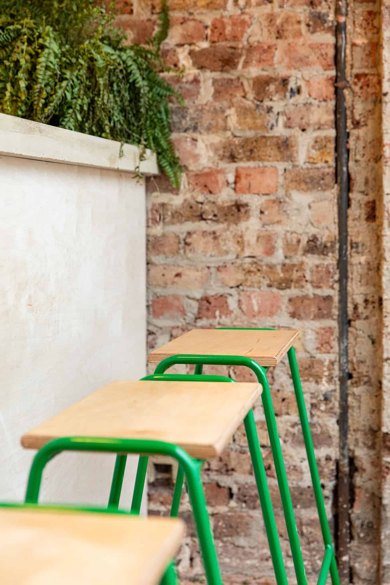 Stools at bar by Ellen Richardson