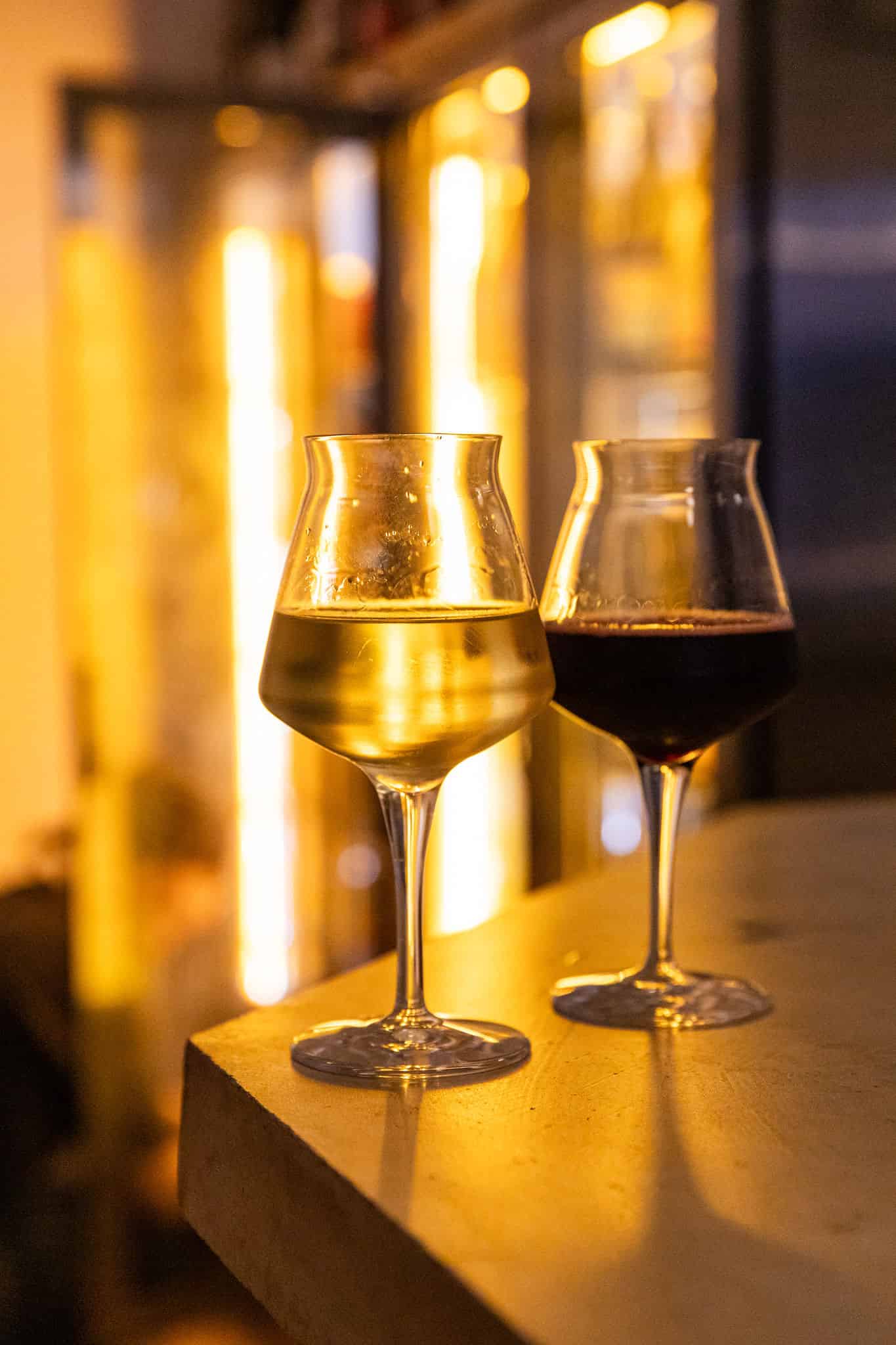 White wine and red in glass by Ellen Richardson